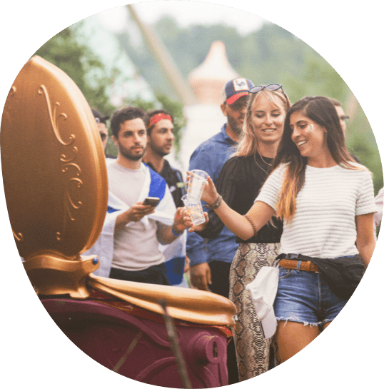Girl throwing cup in the proper recycle bin